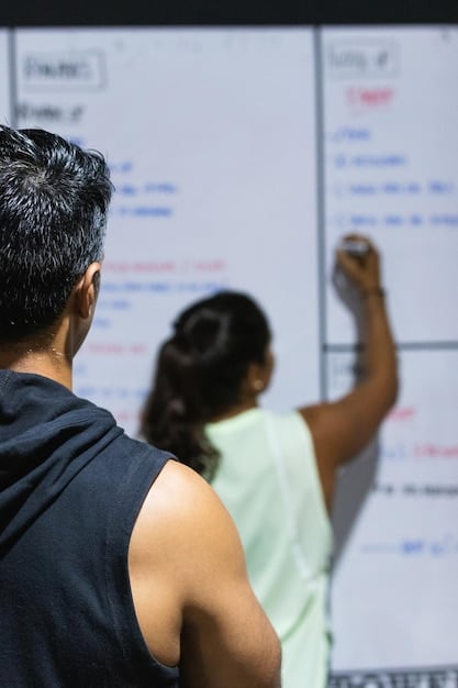 A whiteboard in a strategic planning room with esports game maps and character diagrams, with arrows indicating movement and tactics. People are blurred in the background, discussing strategy.