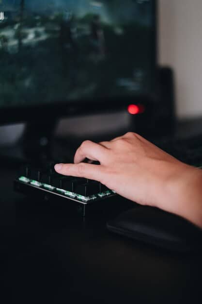 A close-up shot of a person's hands intensely and rapidly pressing keys on a gaming keyboard during an esports match. The focus is on the speed and precision of the hand movements.
