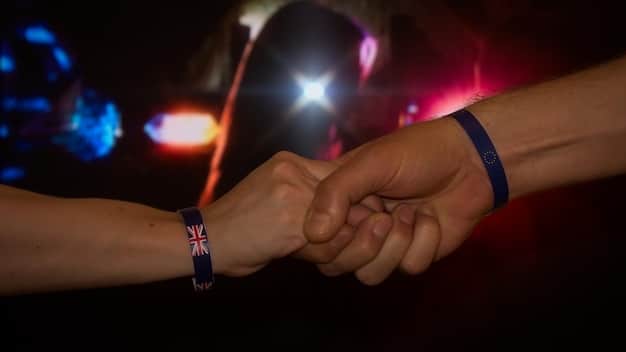 A close-up of two esports athletes shaking hands after a match, showing respect and sportsmanship.
